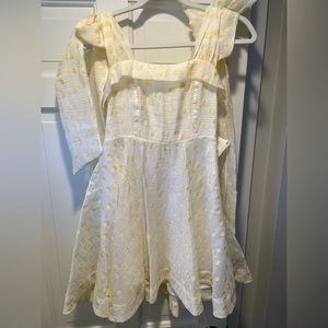 White with yellow polka dot bow tie strap mini dress